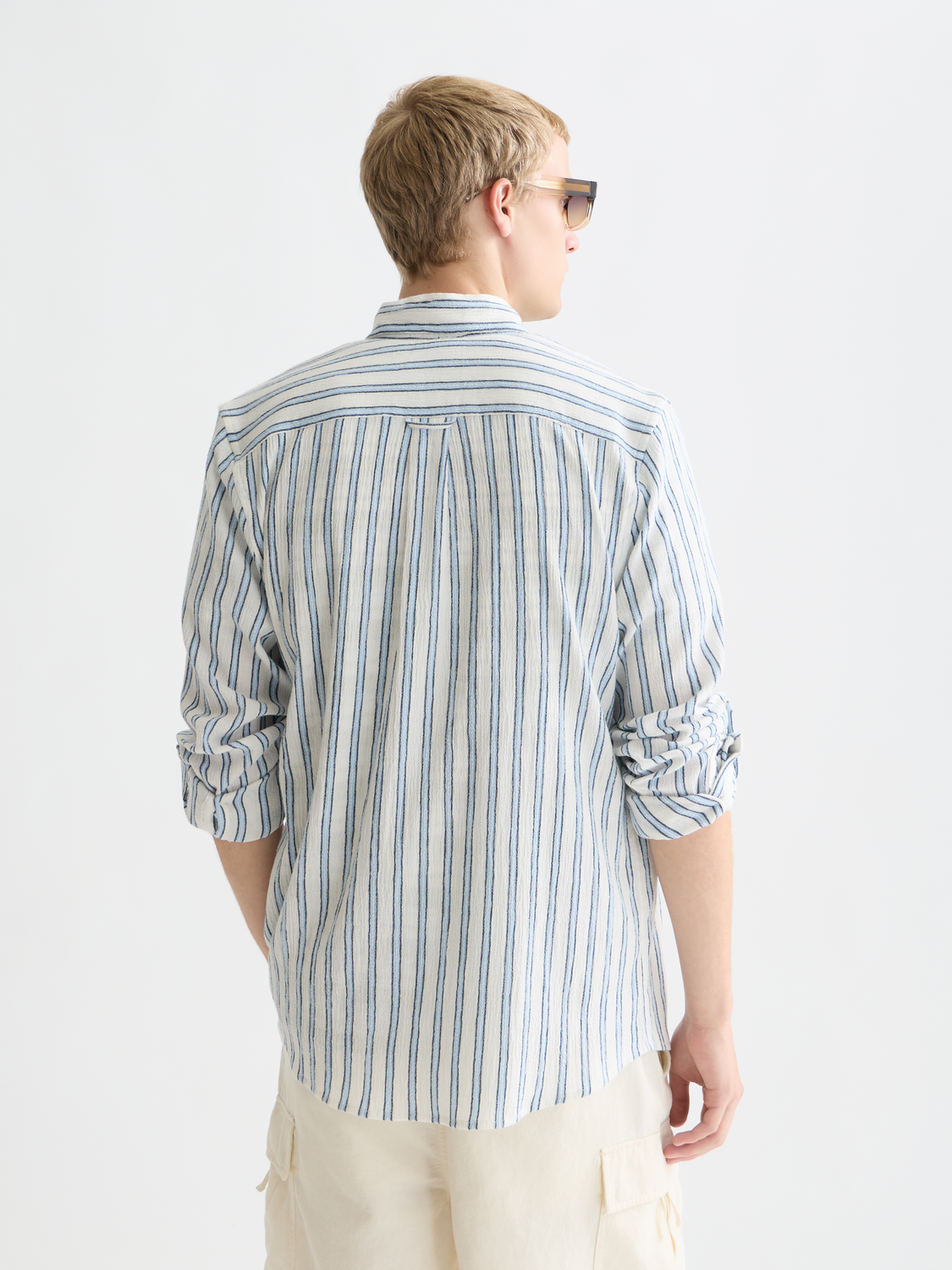 Long sleeve striped crinkle shirt by Scotch & Soda, showing the back view with a relaxed fit and vibrant pattern.