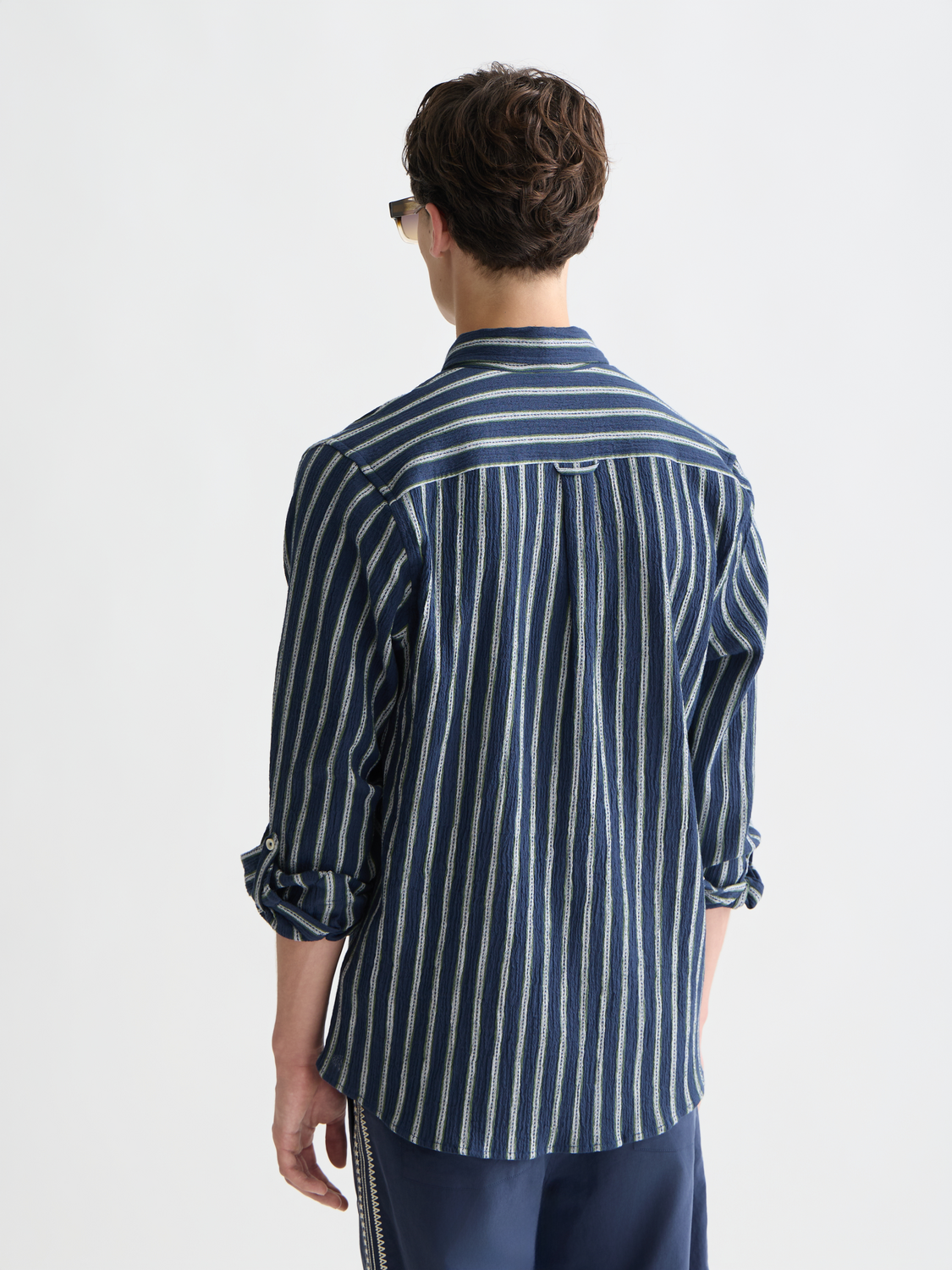 Long sleeve striped crinkle shirt by Scotch & Soda featuring vibrant, textured fabric and a relaxed fit.