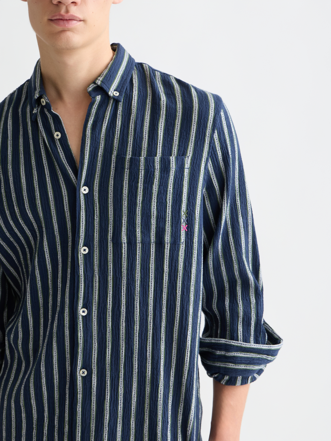 Long sleeve striped crinkle shirt from Scotch & Soda, featuring a relaxed fit and vibrant pattern, displayed on a hanger.