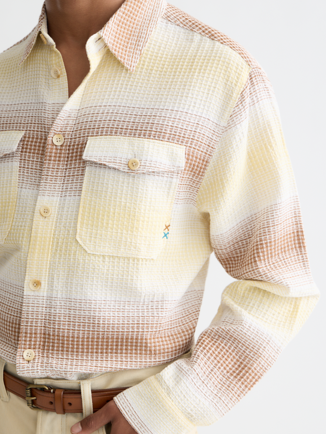 Long-sleeve striped waffle shirt by Scotch & Soda, featuring a comfortable fit and stylish pattern in natural fabric.