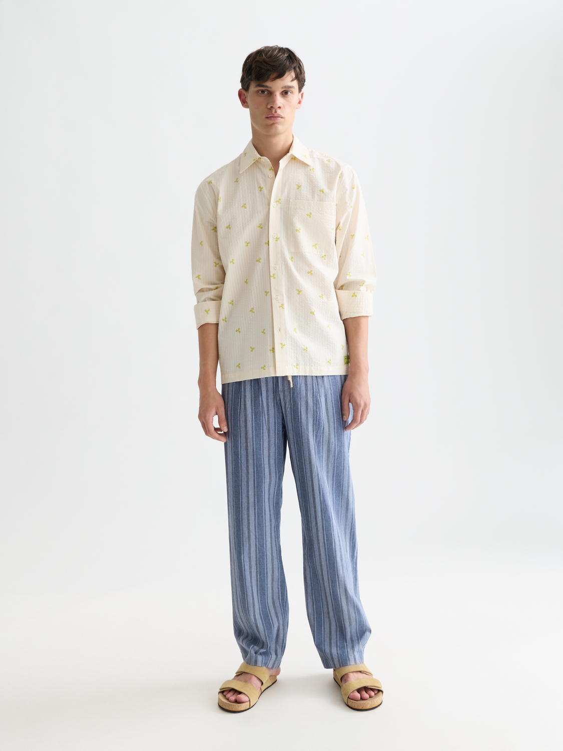 Long sleeve Scotch & Soda seersucker shirt with blue and white striped fabric, button-up front, and classic collar.
