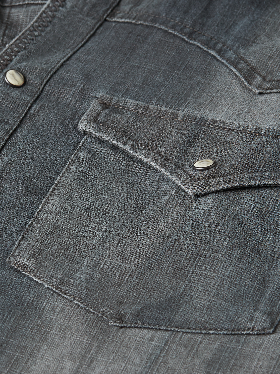 Scotch & Soda washed denim long-sleeve shirt with classic collar and button front, displayed on a hanger.