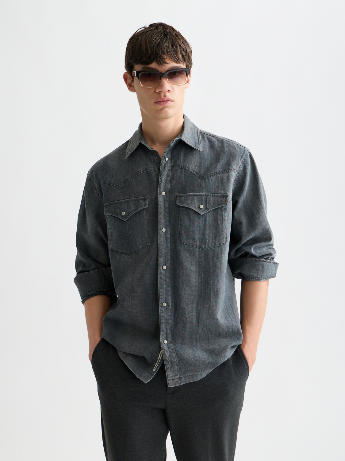Long sleeve washed denim shirt by Scotch & Soda, featuring classic button-down design and front chest pockets.