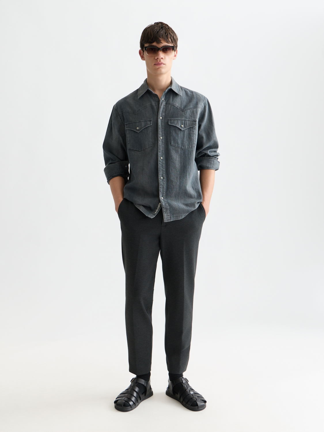 Light blue washed denim long-sleeve shirt by Scotch & Soda, showing front view with collar and button-down design.