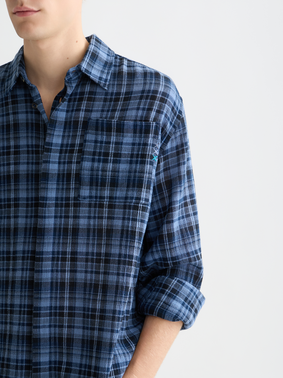 Long-sleeve Scotch & Soda flannel check shirt with red and navy plaid pattern on soft fabric.
