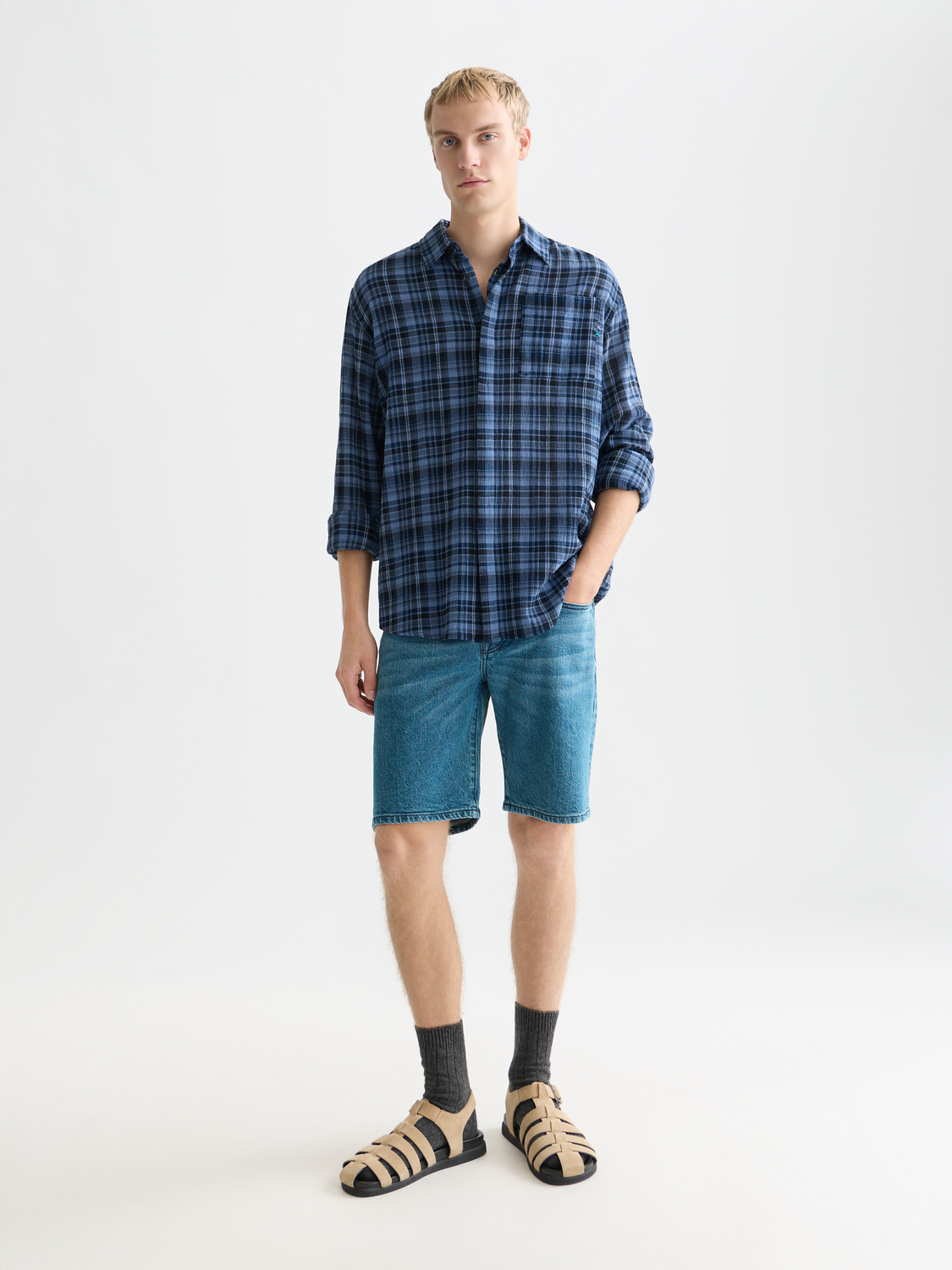 Long-sleeve Scotch & Soda flannel check shirt with a classic red and navy plaid pattern, displayed on a hanger.