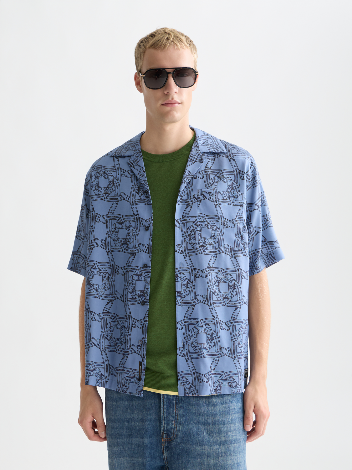 Printed Scotch & Soda short-sleeved shirt with vibrant pattern, casual fit, and button-front design.