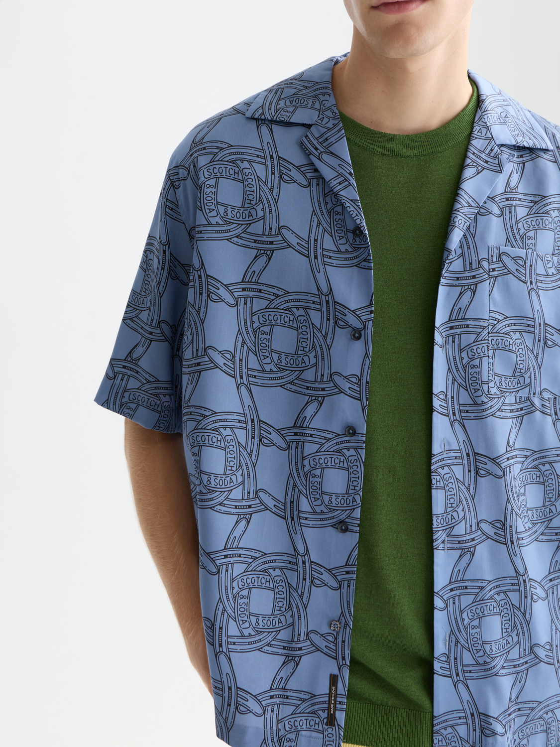 Printed Scotch & Soda short-sleeved shirt with a colorful pattern, casual style, and lightweight fabric for warm weather.