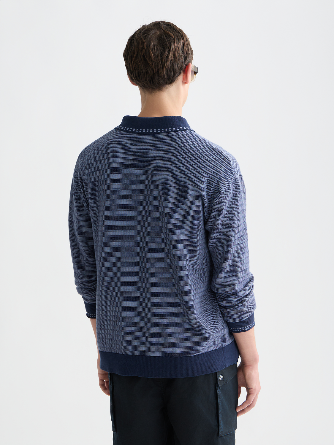 SCOTCH & SODA polo cardigan knitwear in navy with button-up front and ribbed cuffs, shown from the back.