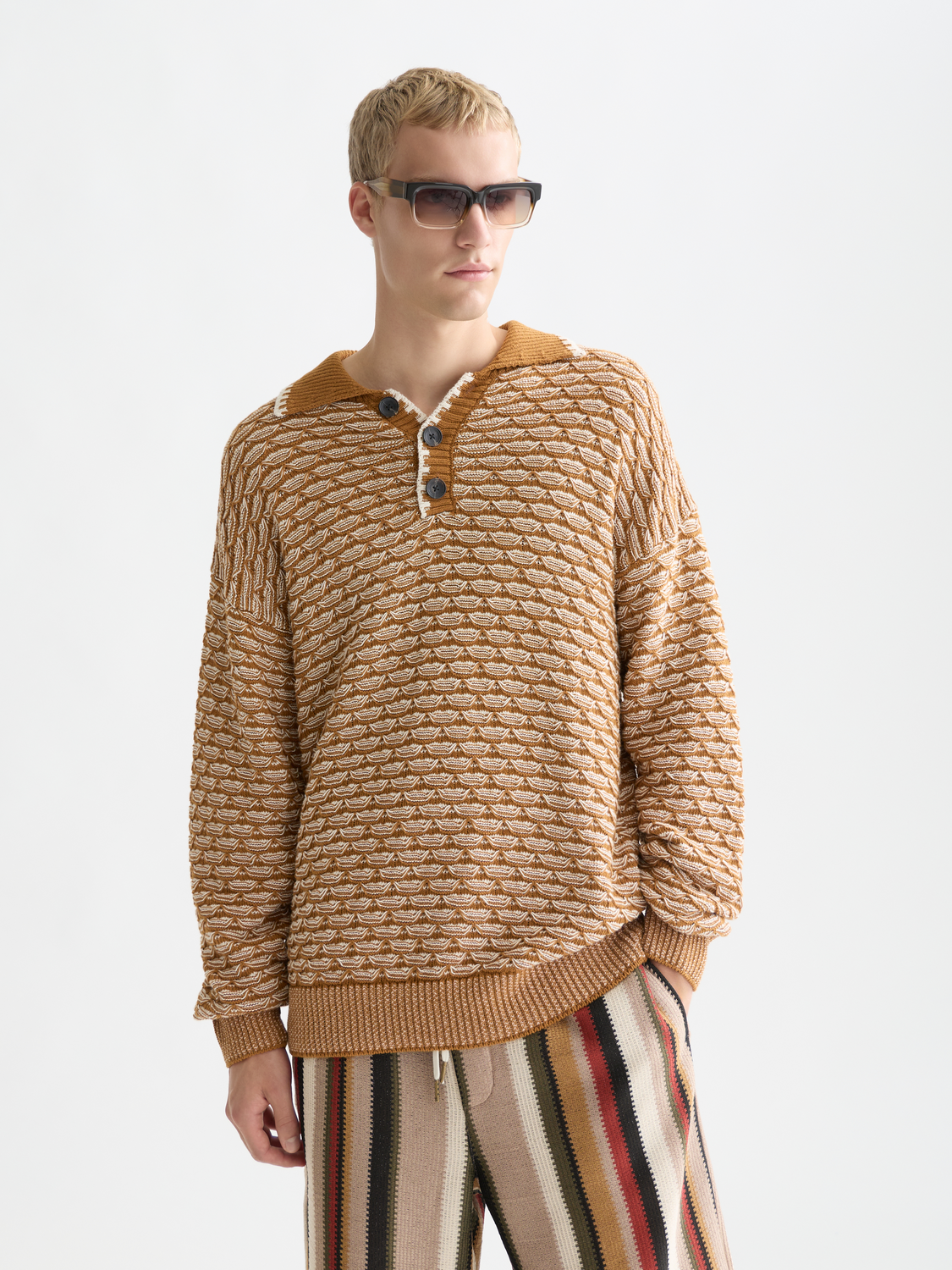 Dropped shoulder knit polo sweater by SCOTCH & SODA, featuring a classic knit design with a relaxed fit and ribbed collar.