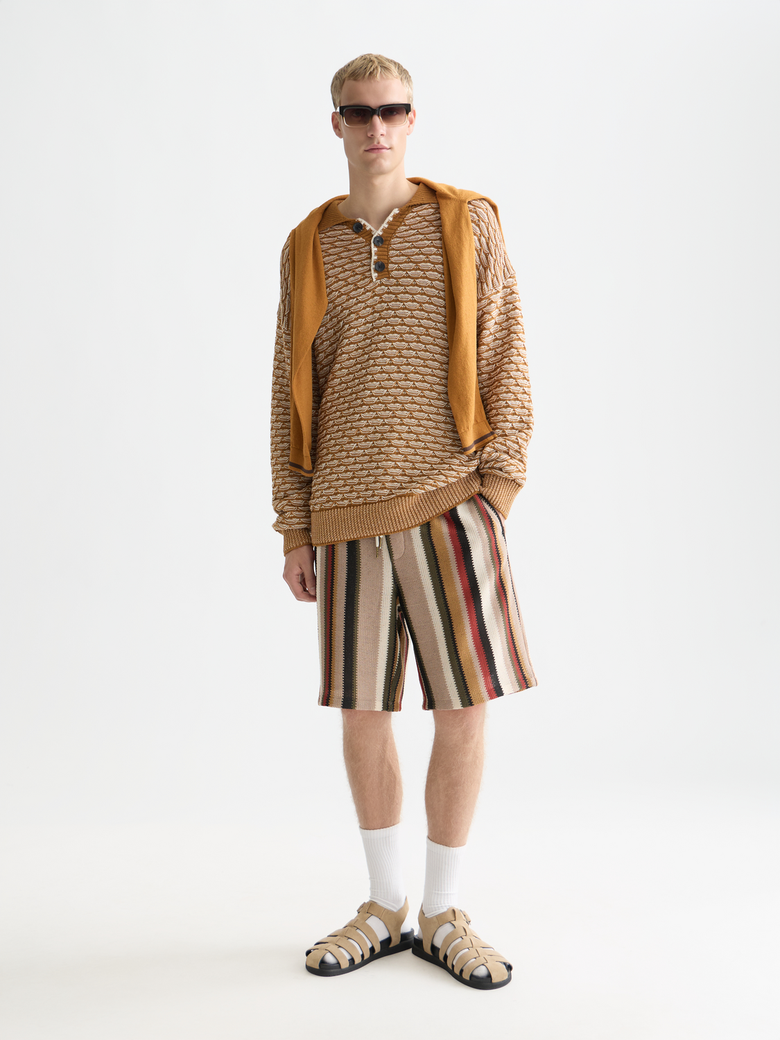 Dropped shoulder knit polo sweater by Scotch & Soda, featuring a cozy knit texture and relaxed fit in neutral colors.