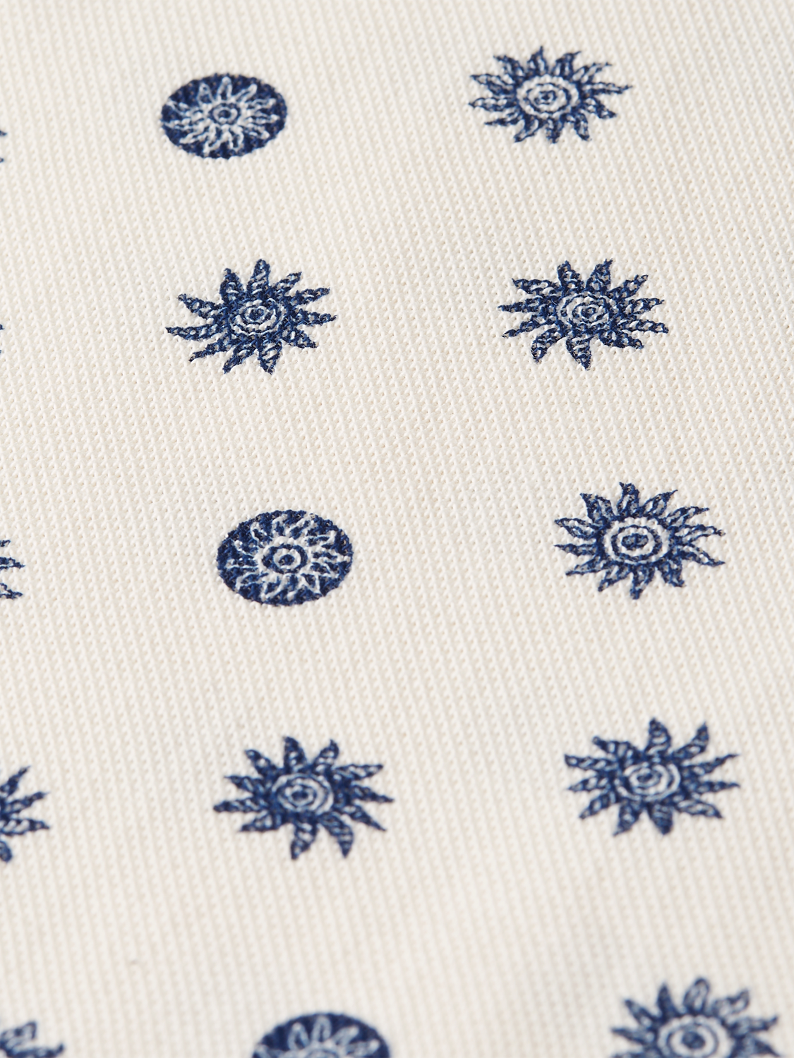 Blue printed polo shirt from Scotch & Soda with a classic collar and short sleeves, showcasing a stylish pattern.