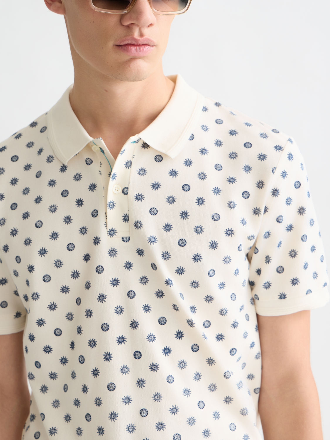 Printed Scotch & Soda polo shirt with colorful pattern, short sleeves, and classic collar, displayed flat on a white background.
