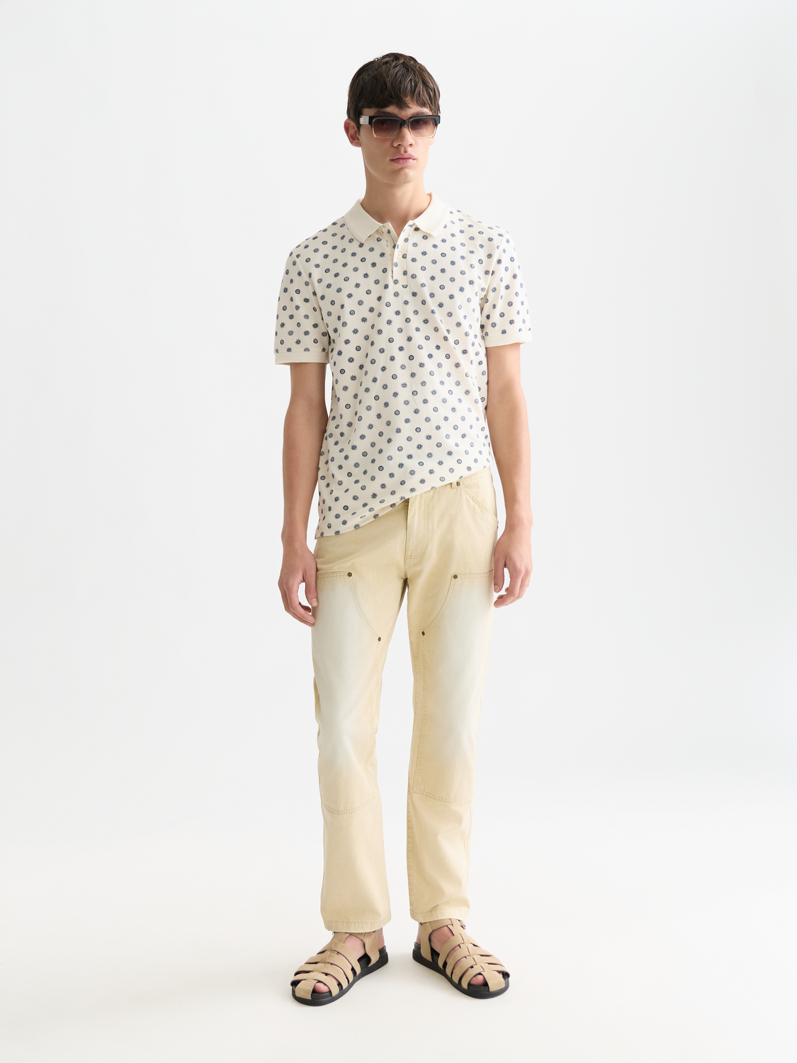 Printed Scotch & Soda polo shirt with colorful design, cotton fabric, and classic collar, front view.
