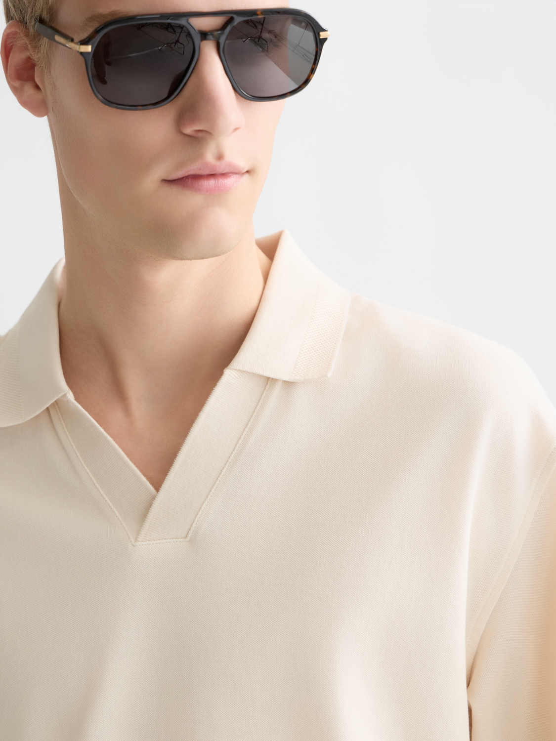 Navy Scotch & Soda pique polo shirt with classic collar and short sleeves, displayed on a plain background.