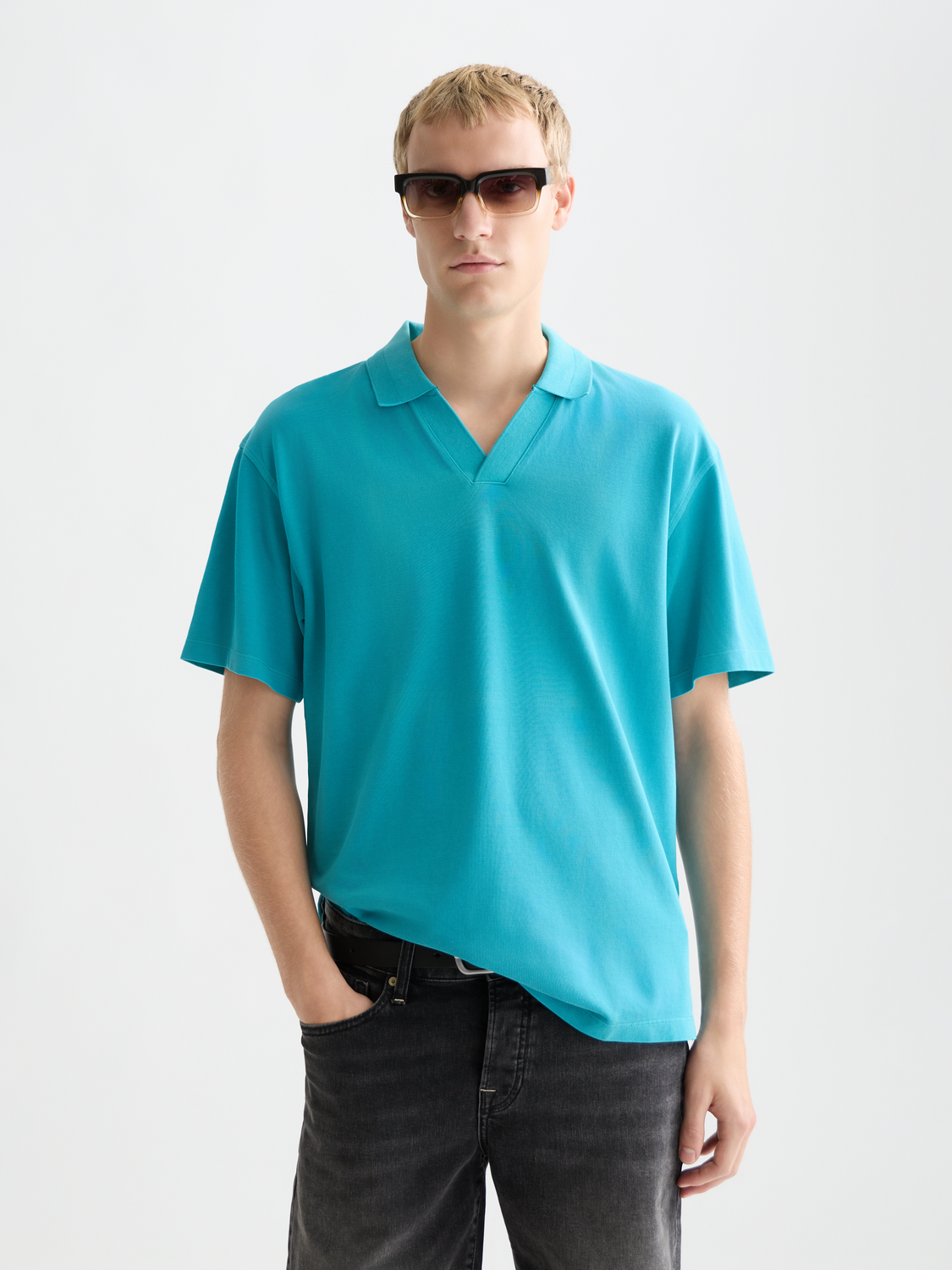 Blue Scotch & Soda pique polo shirt with a classic collar and short sleeves, displayed on a plain background.