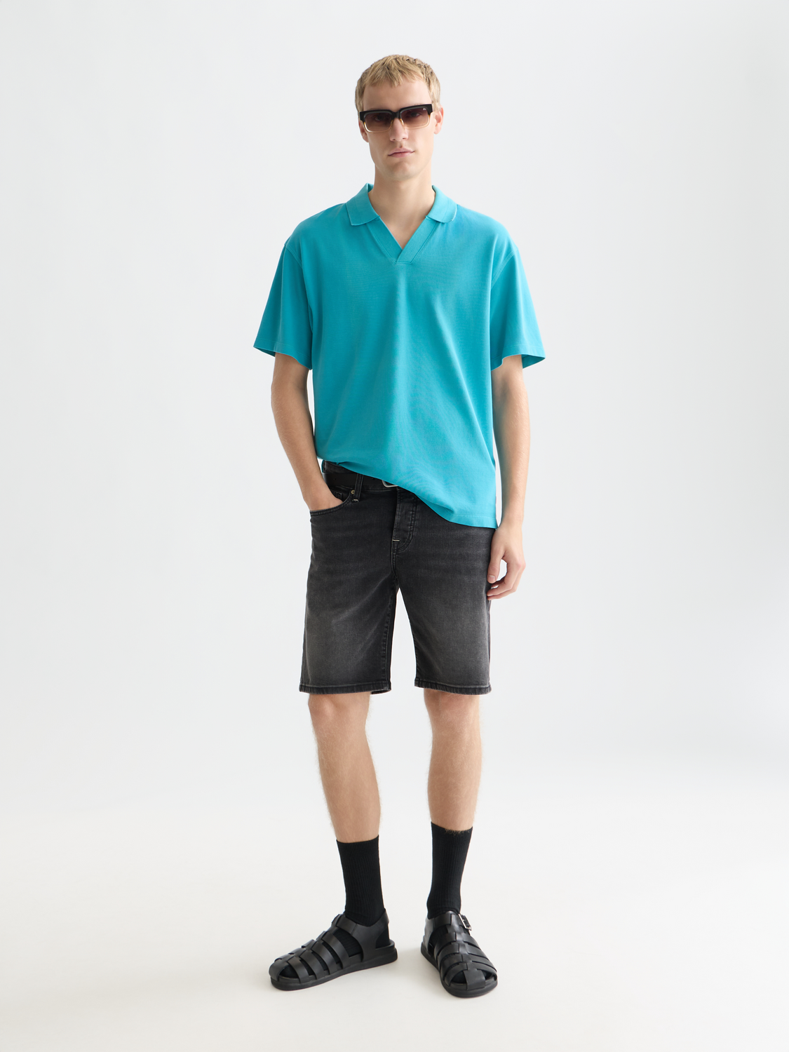 Men's Scotch & Soda pique polo shirt in navy, featuring a classic collar and short sleeves, displayed on a neutral background.