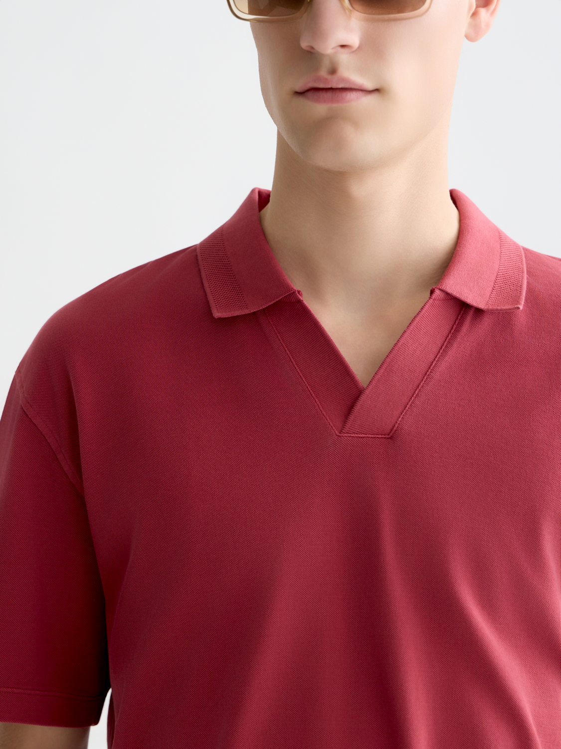 Men's navy blue Scotch & Soda pique polo shirt with a classic collar and short sleeves, displayed on a plain background.