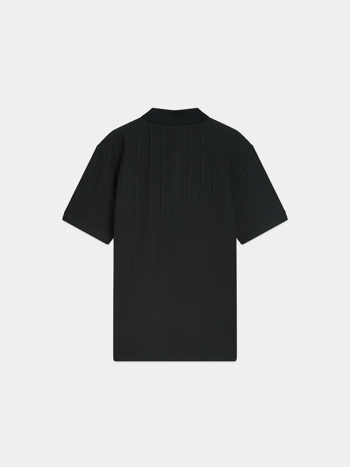 Black Scotch & Soda ribbed polo shirt with a classic collar and short sleeves, displayed on a plain background.
