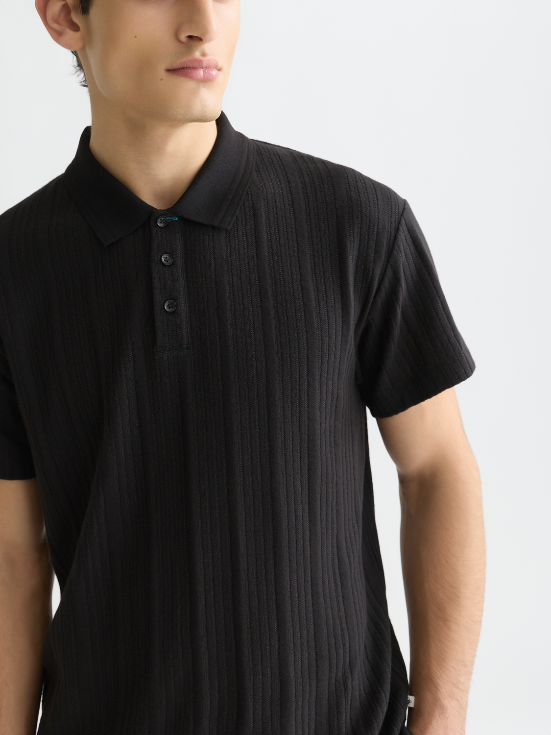 Navy ribbed SCOTCH & SODA polo shirt with a classic collar and short sleeves, displayed flat on a white background.
