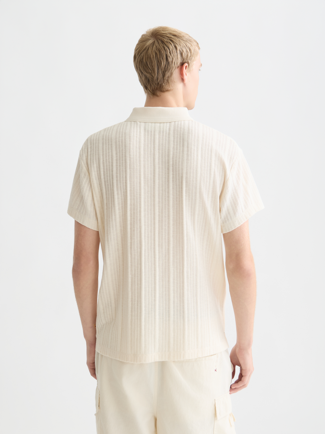 Scarlet red Scotch & Soda ribbed polo shirt with a classic collar and short sleeves, shown from the back view.