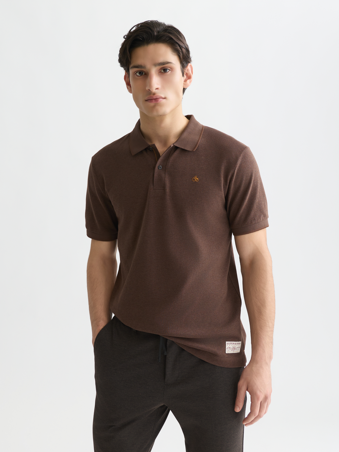 Scotch & Soda Melange polo shirt in navy with short sleeves and classic collar, displayed on a plain background.