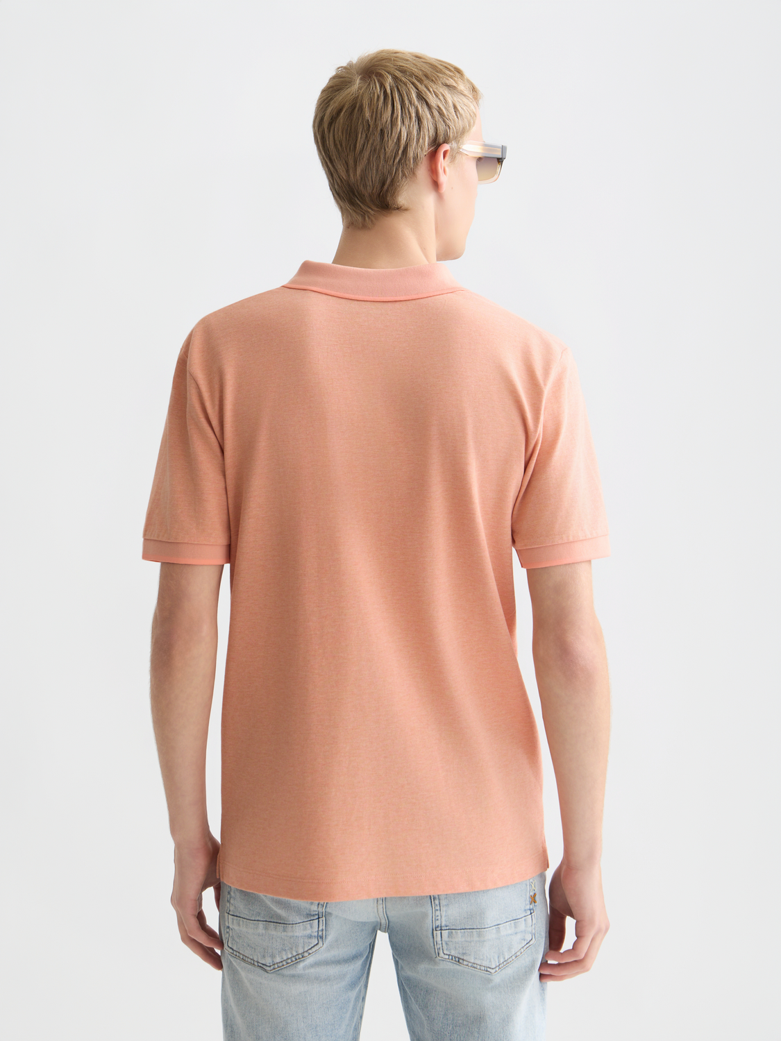 Scotch & Soda Melange polo shirt in a melange fabric featuring a classic collar and short sleeves, front button placket.