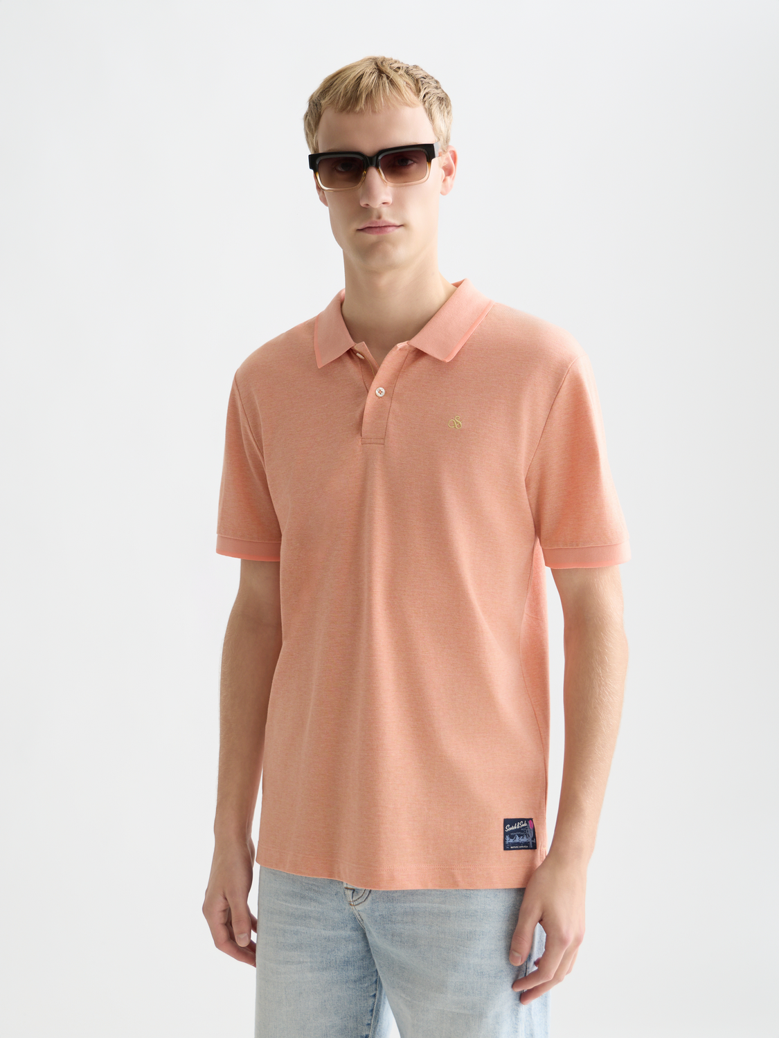 Scotch & Soda men's melange polo shirt with a classic collar and short sleeves, in a soft textured fabric.