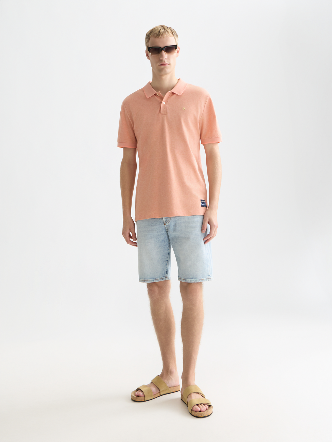 Scotch & Soda melange polo shirt in dark grey with a classic collar and short sleeves, displayed on a plain background.