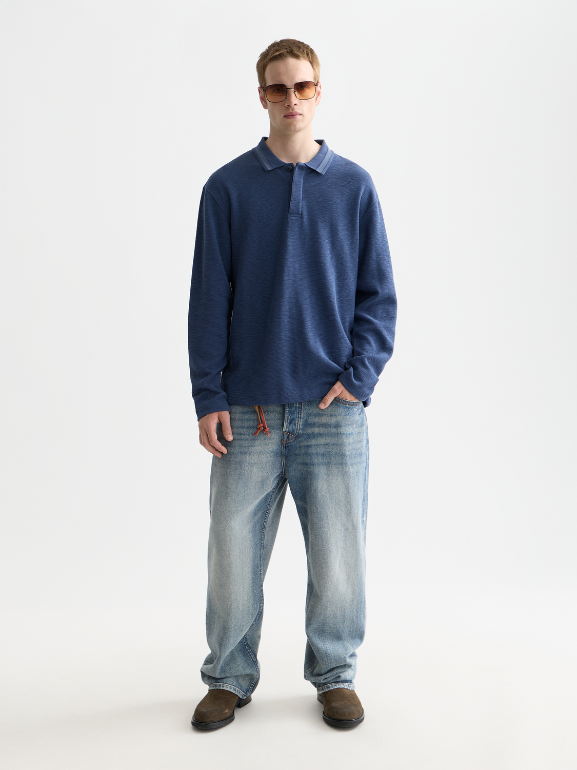 Long-sleeved navy polo shirt by Scotch & Soda, featuring a classic collar and button placket.