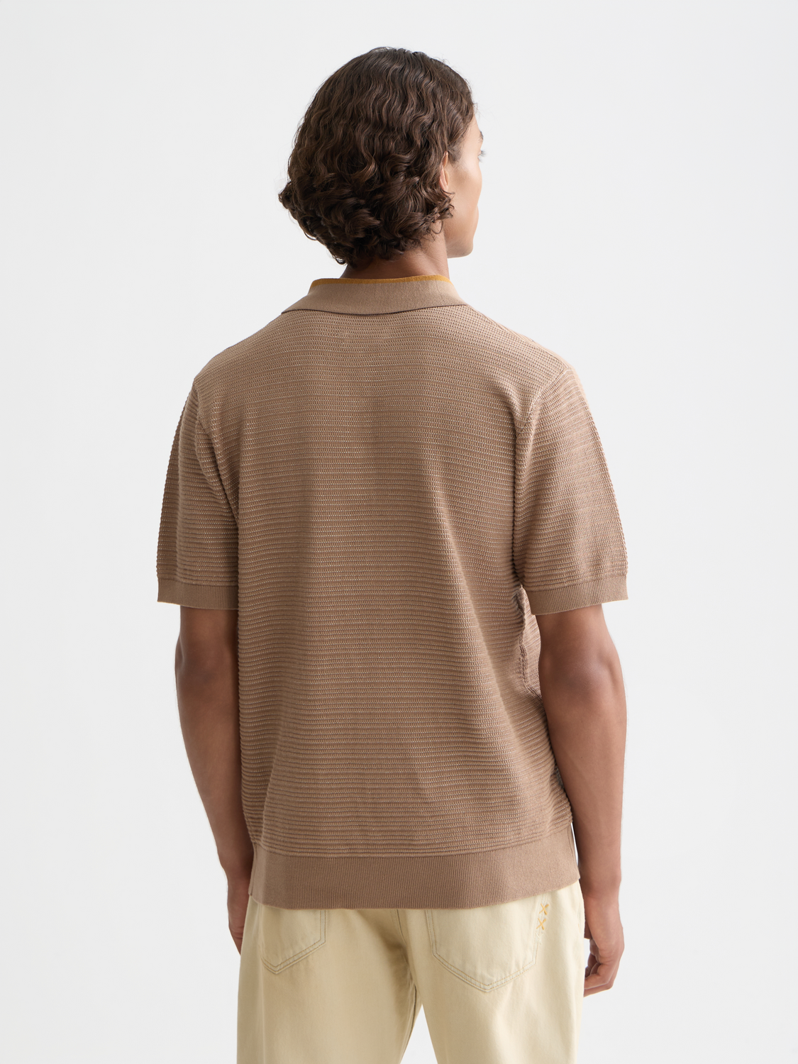 Structured navy knit polo shirt by Scotch & Soda, featuring a classic collar and textured knit fabric.