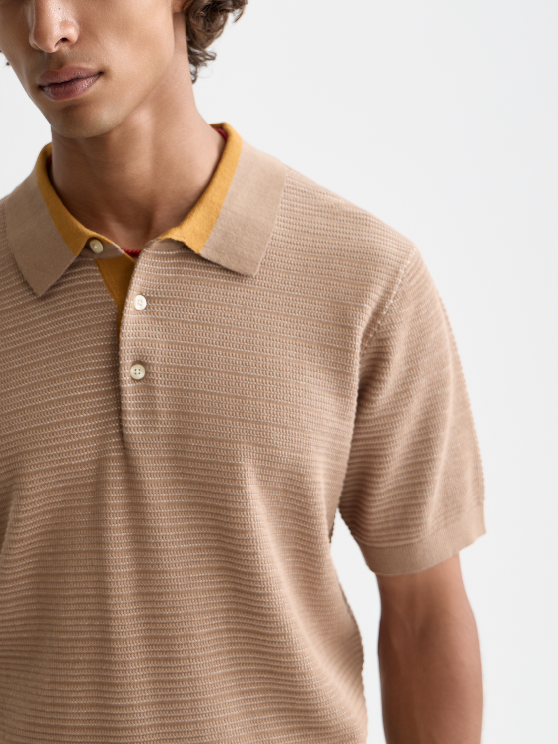 Structured knit polo shirt by Scotch & Soda featuring a classic collar, button placket, and textured knit fabric.