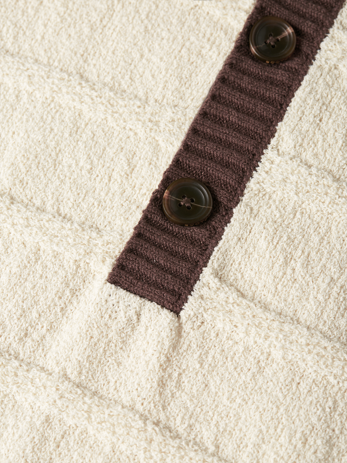 Gray knitted polo shirt by Scotch & Soda, featuring a classic collar and textured knit fabric.
