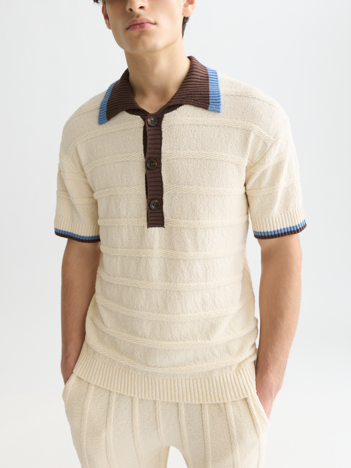 Scarlet knitted polo shirt from Scotch & Soda with a classic collar and textured knit fabric.