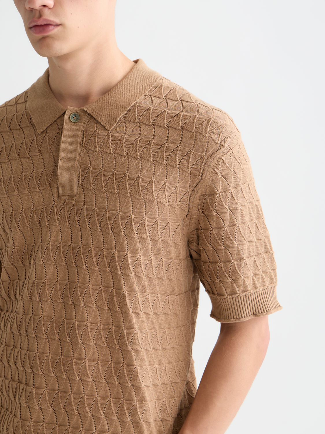 Knitted polo shirt by Scotch & Soda featuring a classic collar and textured knit fabric, in a stylish design.