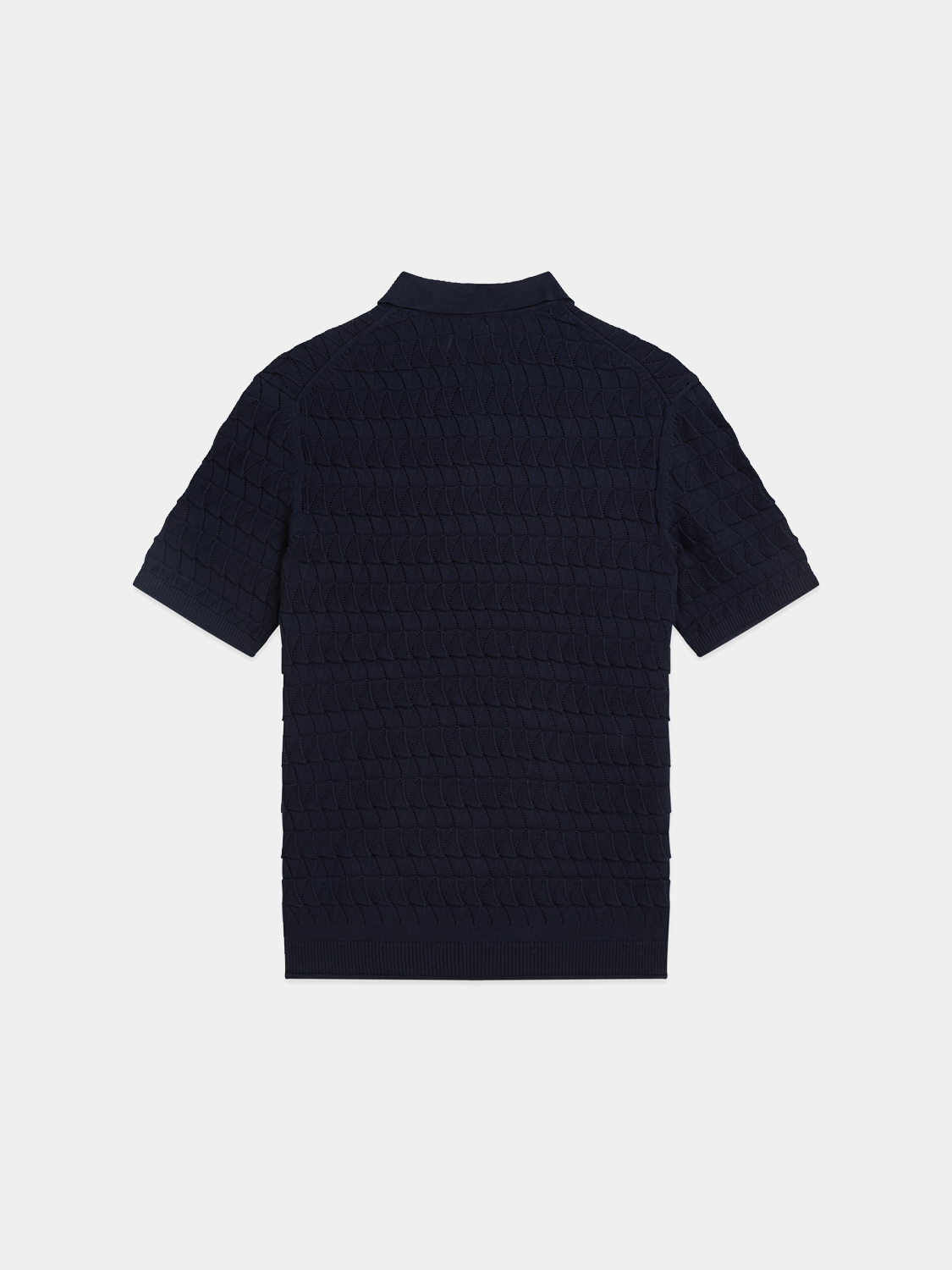 Black knitted polo shirt from Scotch & Soda, featuring a classic collar and textured knit fabric.