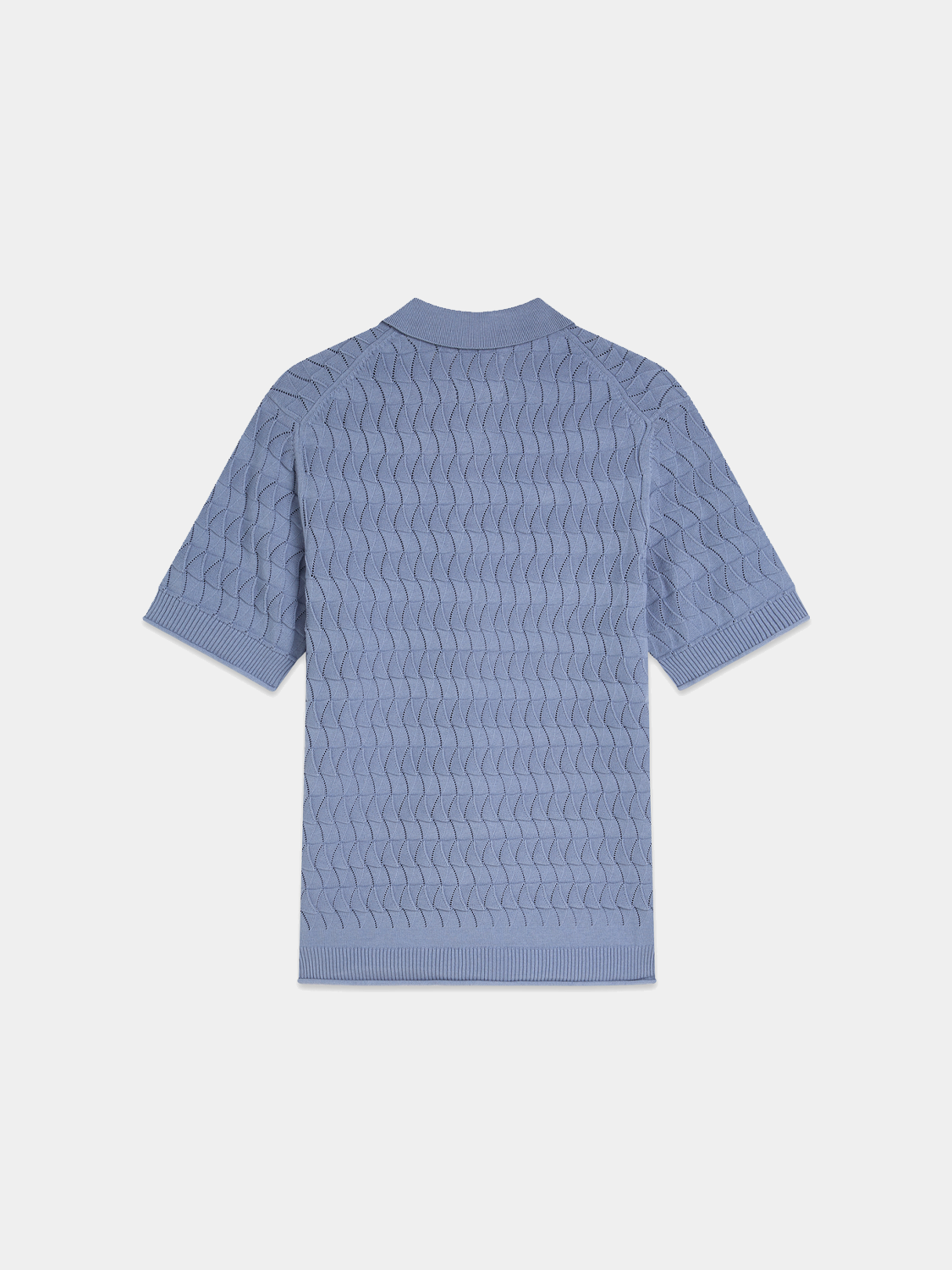 Black knitted polo shirt by Scotch & Soda, featuring a classic collar and textured knit fabric.