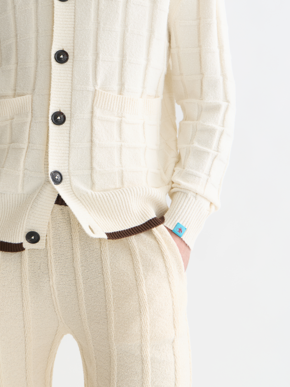 Structured boucle cardigan knitwear by Scotch & Soda, featuring textured boucle fabric and a tailored fit.