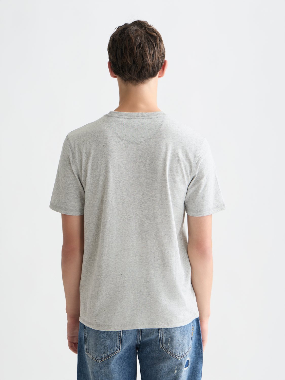 Scotch & Soda men's short sleeve Melange T-shirt featuring a soft knit fabric and casual fit, shown from the back.