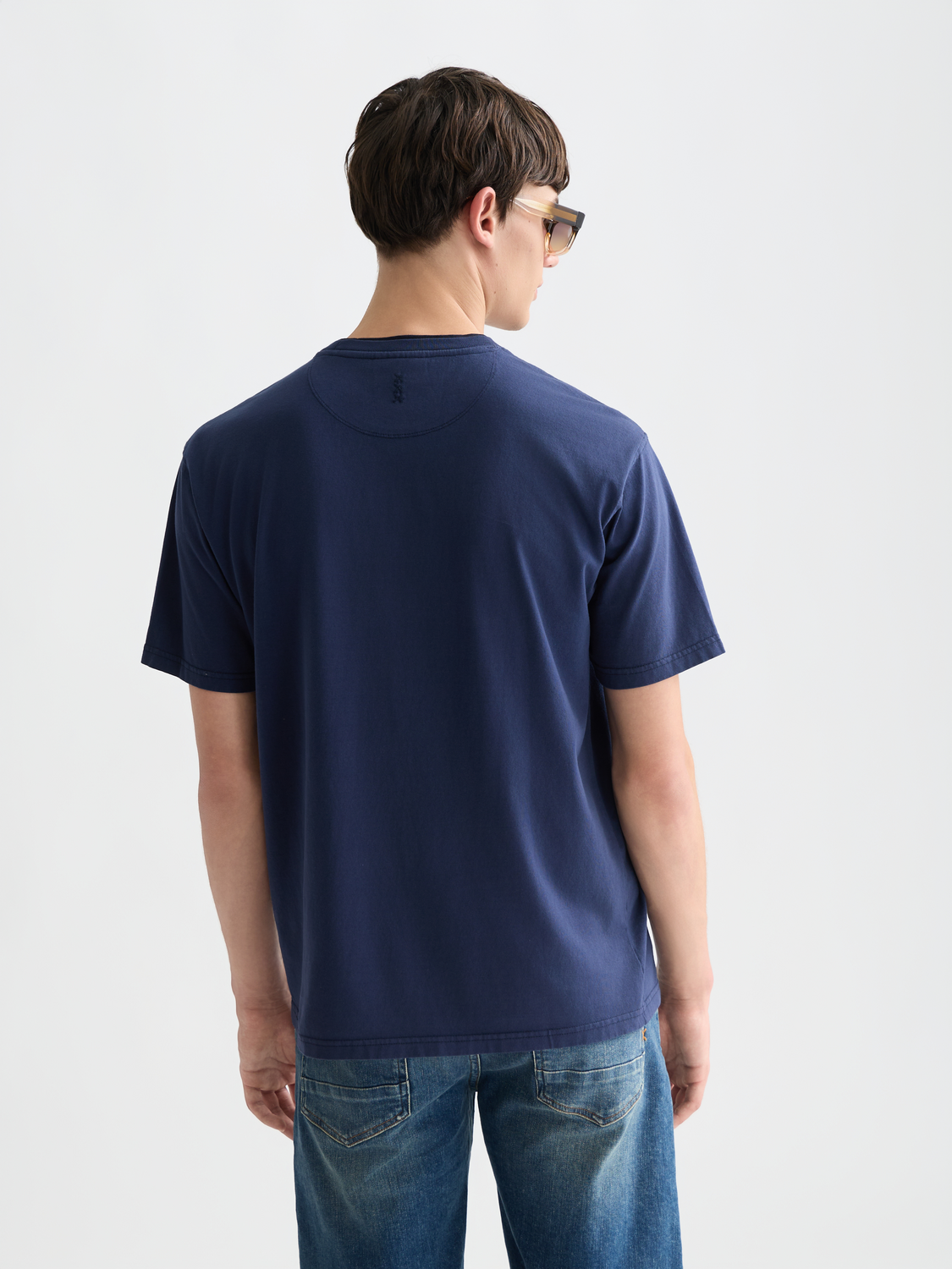 Scotch & Soda short-sleeve garment-dyed t-shirt with a casual fit and back detail, showcased on a white background.