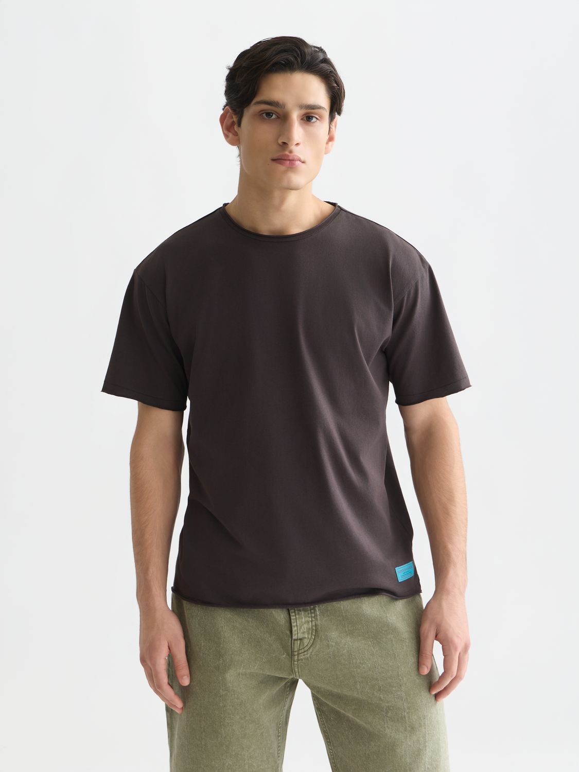 Raw edge Scotch & Soda short sleeve t-shirt with a casual fit and distressed hem, displayed on a neutral background.