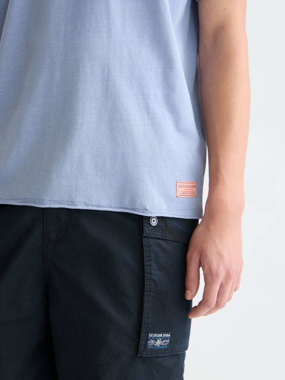 Raw edge SCOTCH & SODA short sleeve t-shirt with a casual fit and distressed neckline, shown in a neutral color.