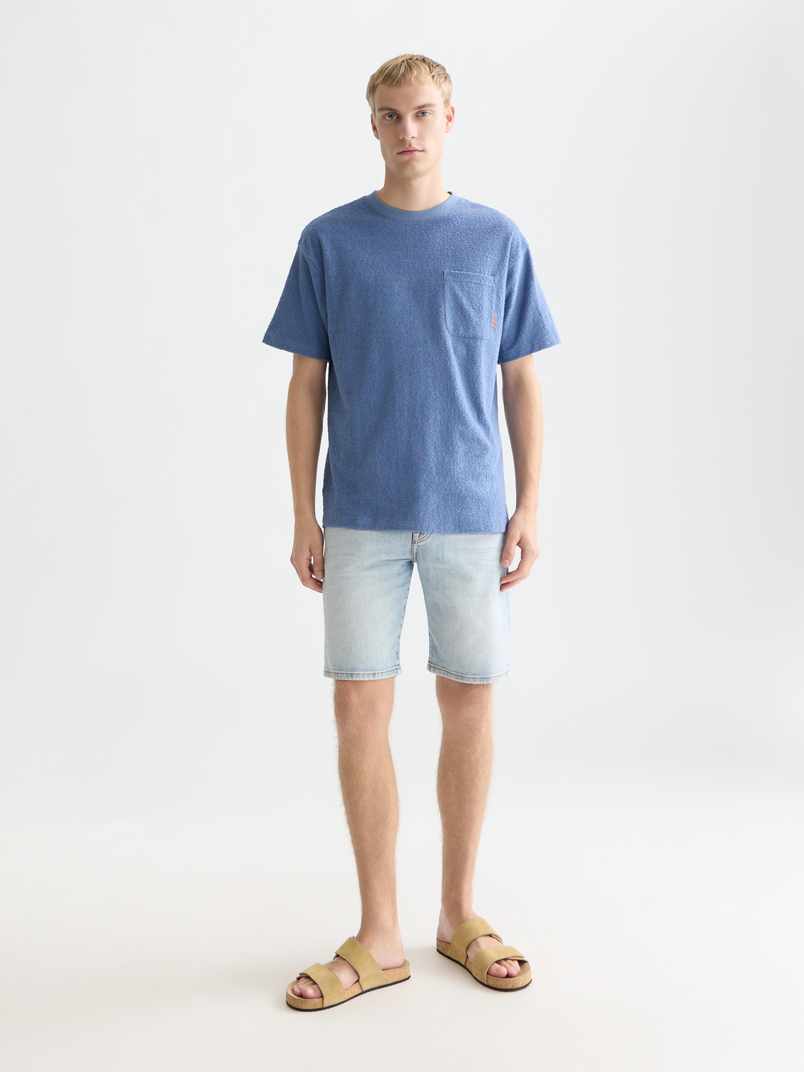 Jacquard towelling Scotch & Soda short-sleeve t-shirt with textured fabric and crew neckline, displayed on a model.