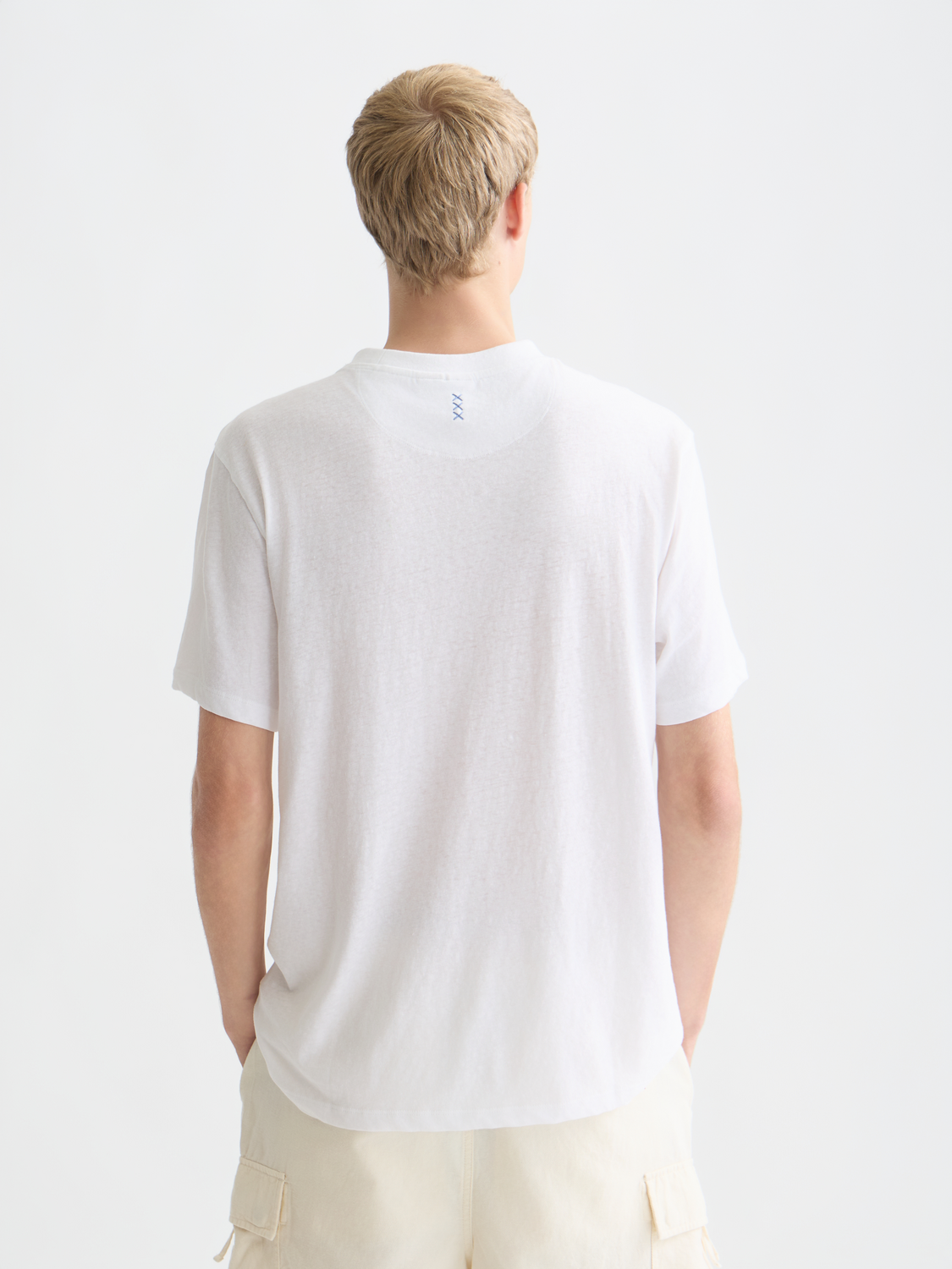 Light beige cotton-linen short-sleeve t-shirt by Scotch & Soda, shown from the back with a relaxed fit and casual style.