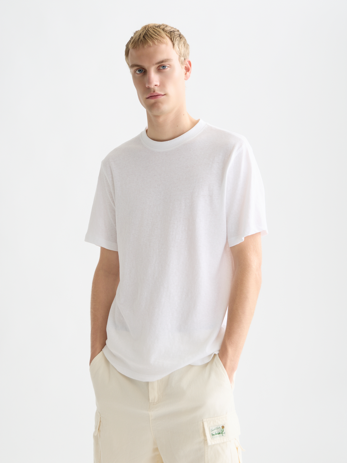 Light beige cotton-linen short-sleeve t-shirt by Scotch & Soda, front view showing relaxed fit and fabric texture.