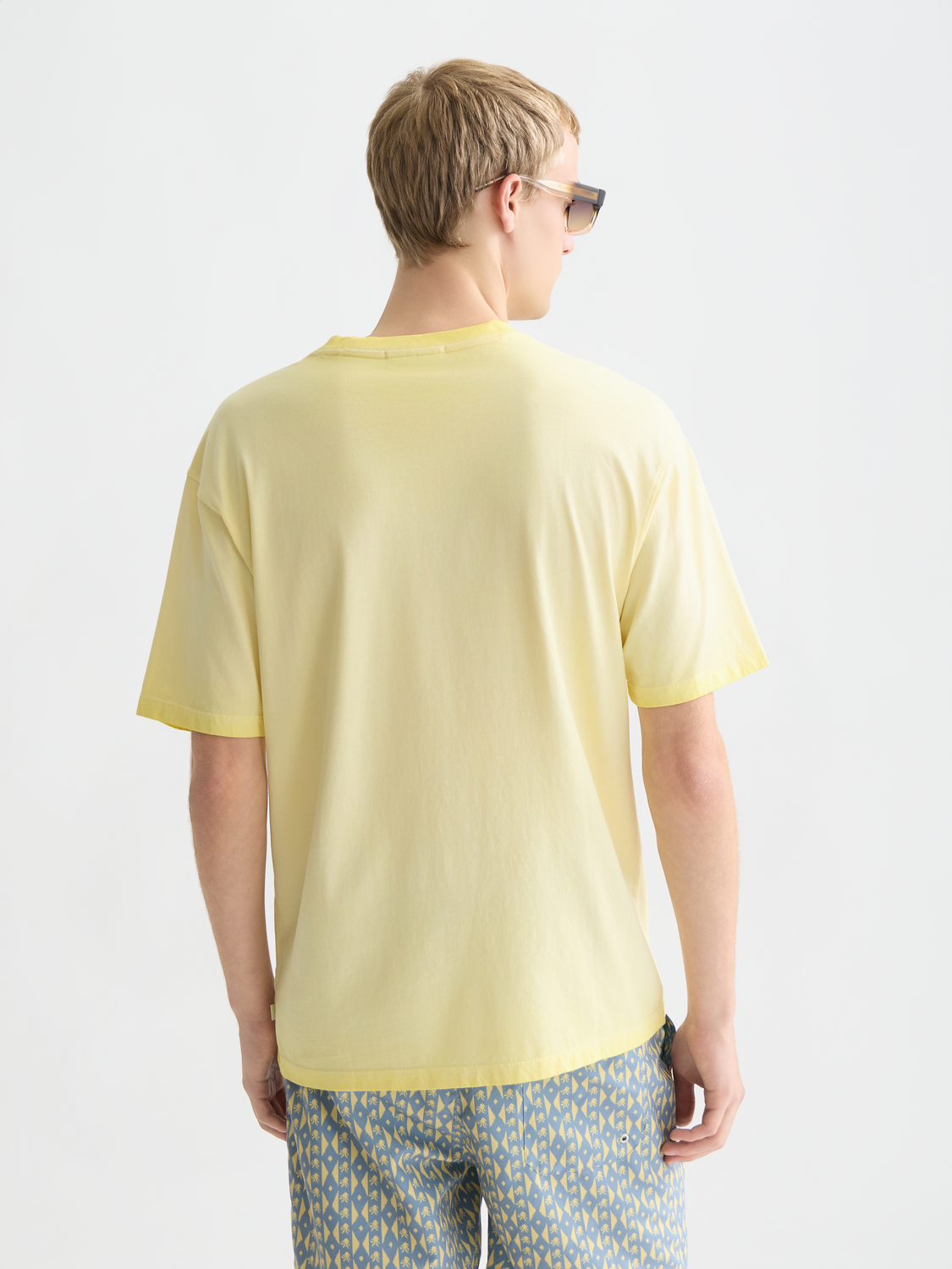 Scotch & Soda artwork short-sleeve t-shirt featuring a colorful graphic print on the back, casual men's fashion tee.