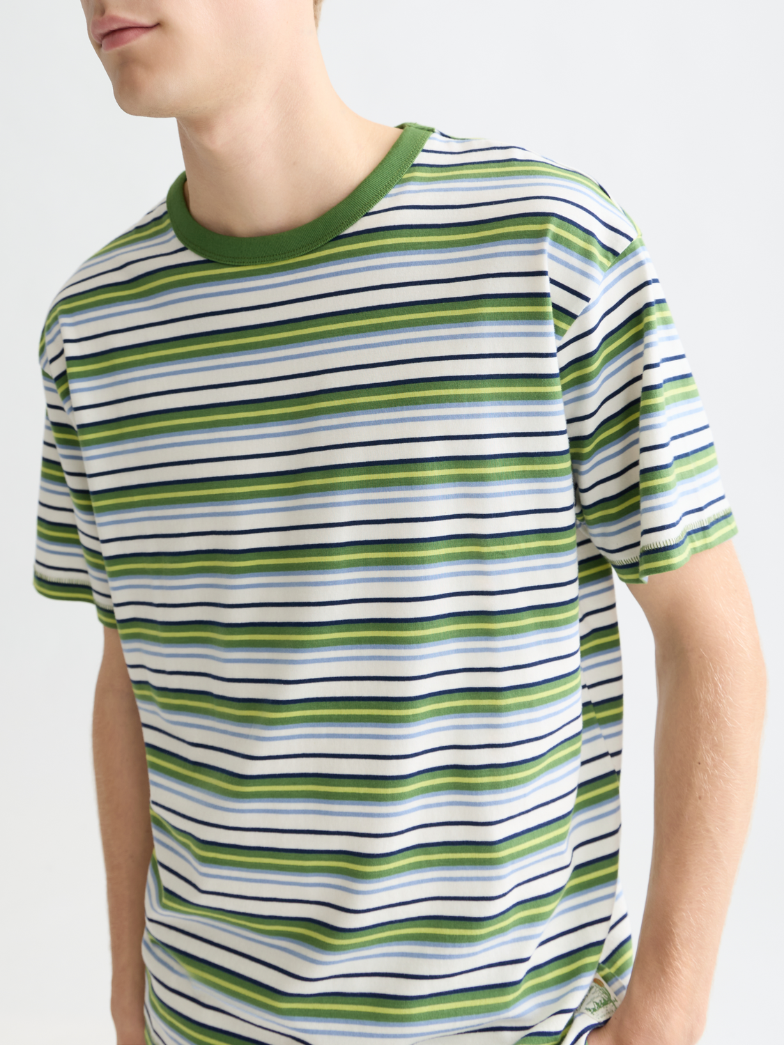 Yarn-dyed Scotch & Soda short-sleeve t-shirt with a vibrant, woven pattern and casual fit, displayed on a plain background.