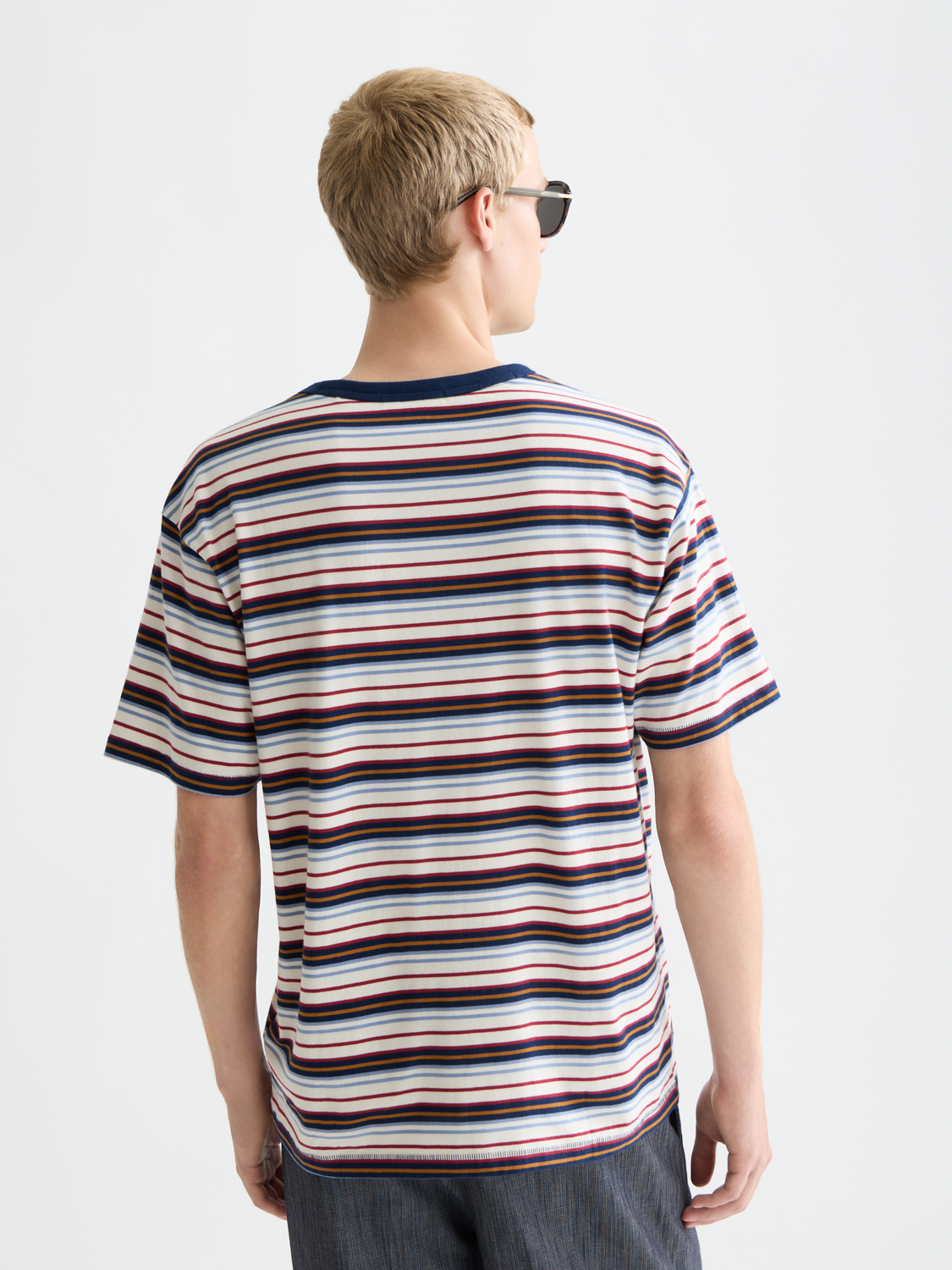 Yarn-dyed Scotch & Soda short-sleeve T-shirt in a vibrant color, shown from the back with visible stitching and fabric texture.