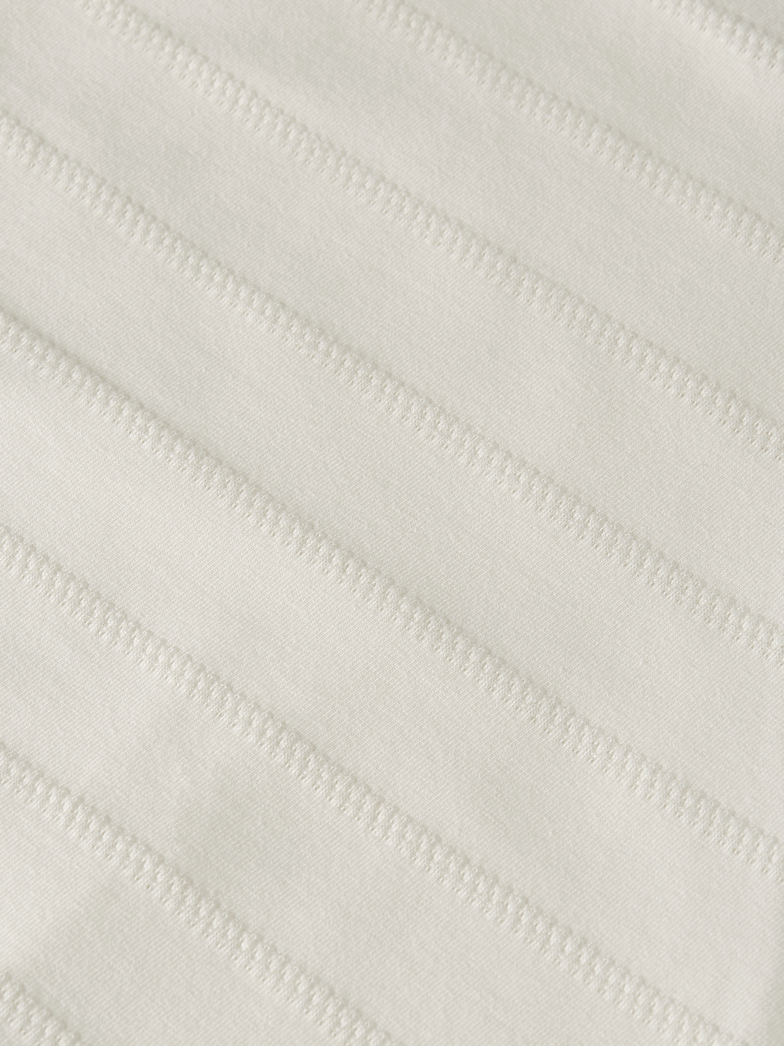 SCOTCH & SODA jacquard short-sleeve t-shirt with intricate woven pattern and crew neckline, displayed on a plain background.