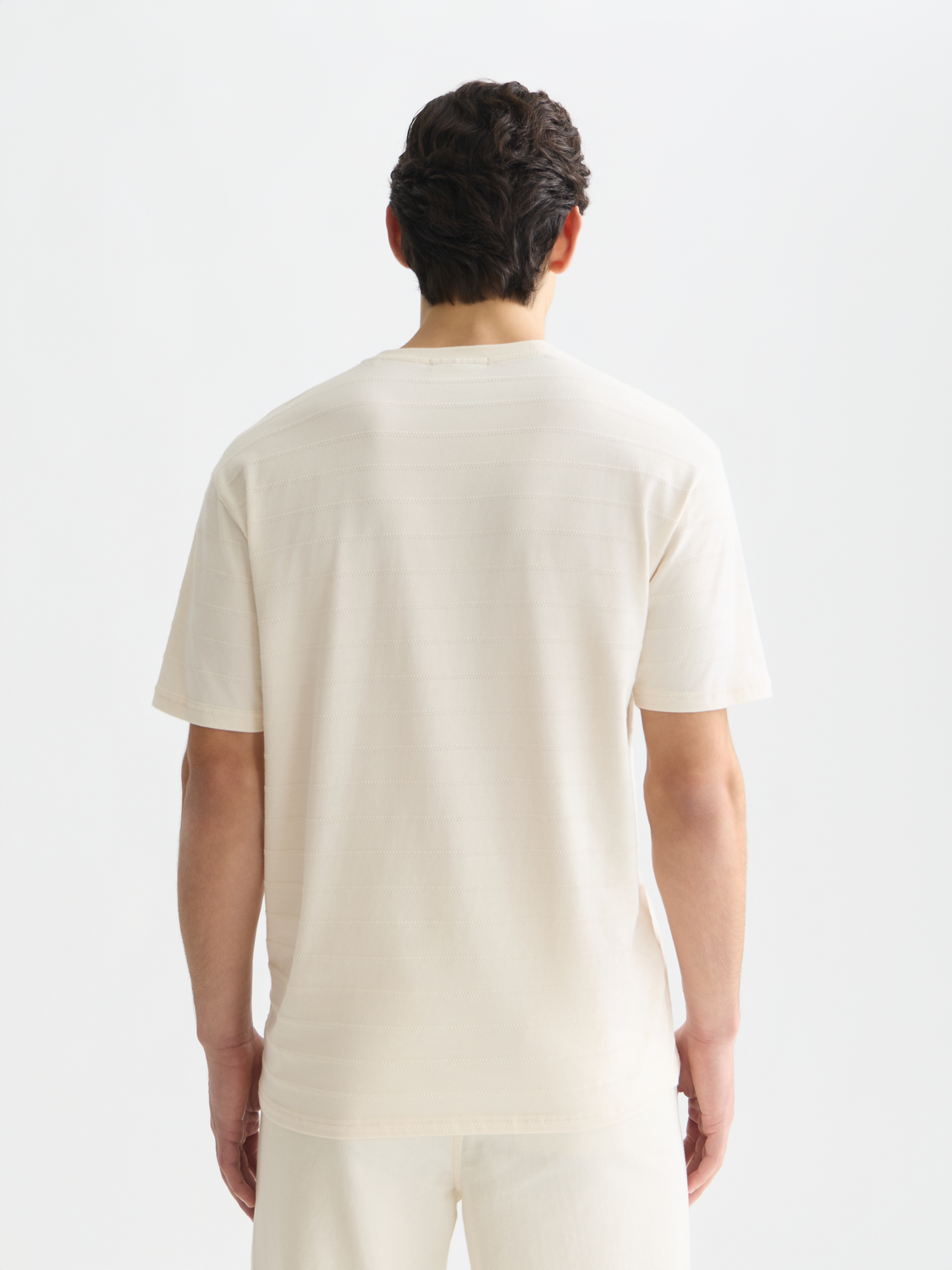 Scotch & Soda short-sleeve jacquard T-shirt with intricate woven pattern, shown from the back in the image.